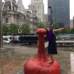 Posing by statues in downtown Philly